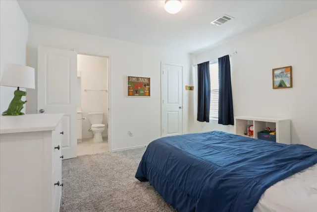 a bedroom with a bed and a cabinets