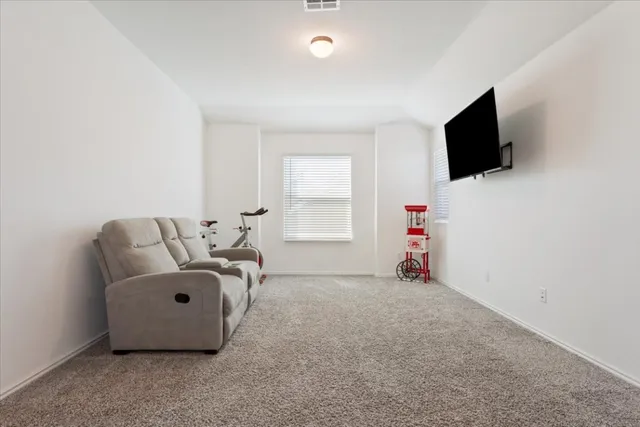 a view of livingroom with furniture and a flat screen tv