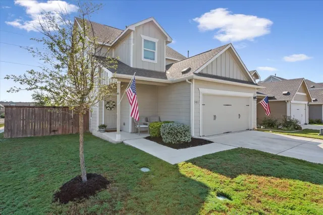 a front view of a house with a yard