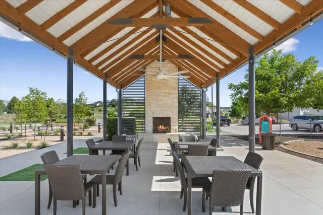 a dining room with furniture a window and a fireplace