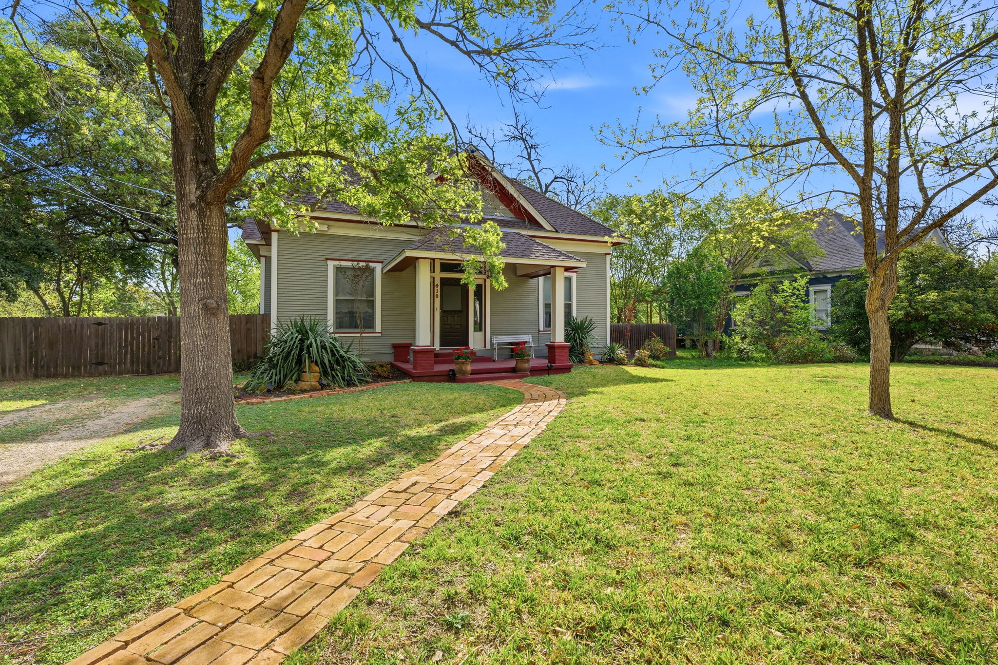 410 Cibilo Street Lockhart, TX 78644 - Photo 14 of 36 a view of a house with backyard and a tree