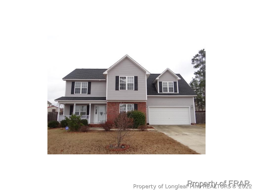 235 Hillandale Road Spring Lake, NC 28390 - Photo 1 of 25 a house view with a garden space