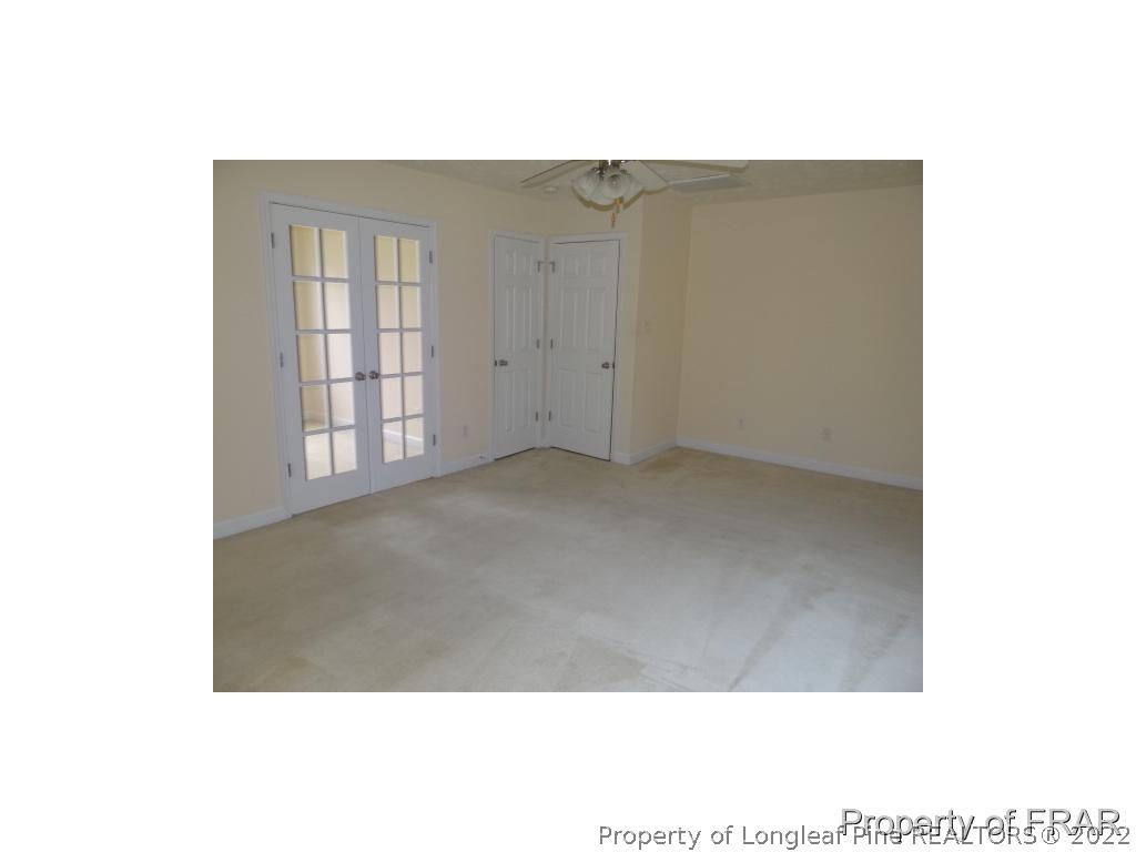 235 Hillandale Road Spring Lake, NC 28390 - Photo 20 of 25 a view of an empty room with windows