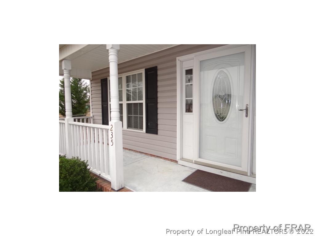 235 Hillandale Road Spring Lake, NC 28390 - Photo 2 of 25 a view of a house with a small yard