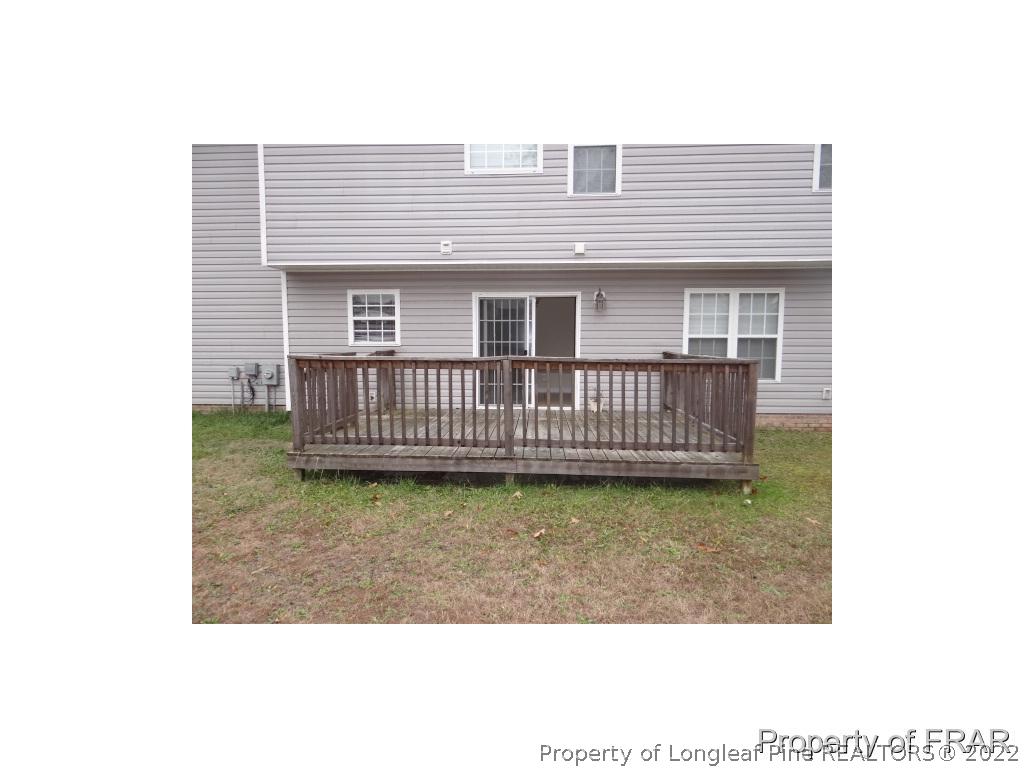 235 Hillandale Road Spring Lake, NC 28390 - Photo 23 of 25 a view of a house with wooden floor roof and a porch
