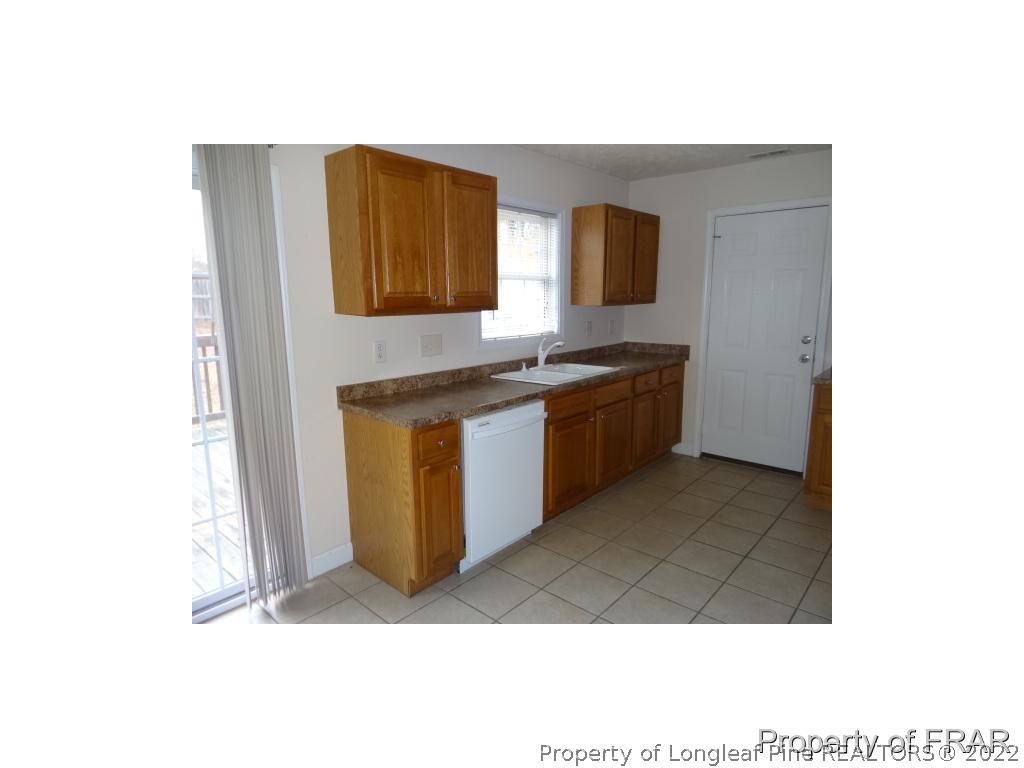 235 Hillandale Road Spring Lake, NC 28390 - Photo 7 of 25 a kitchen with a sink and a stove top oven