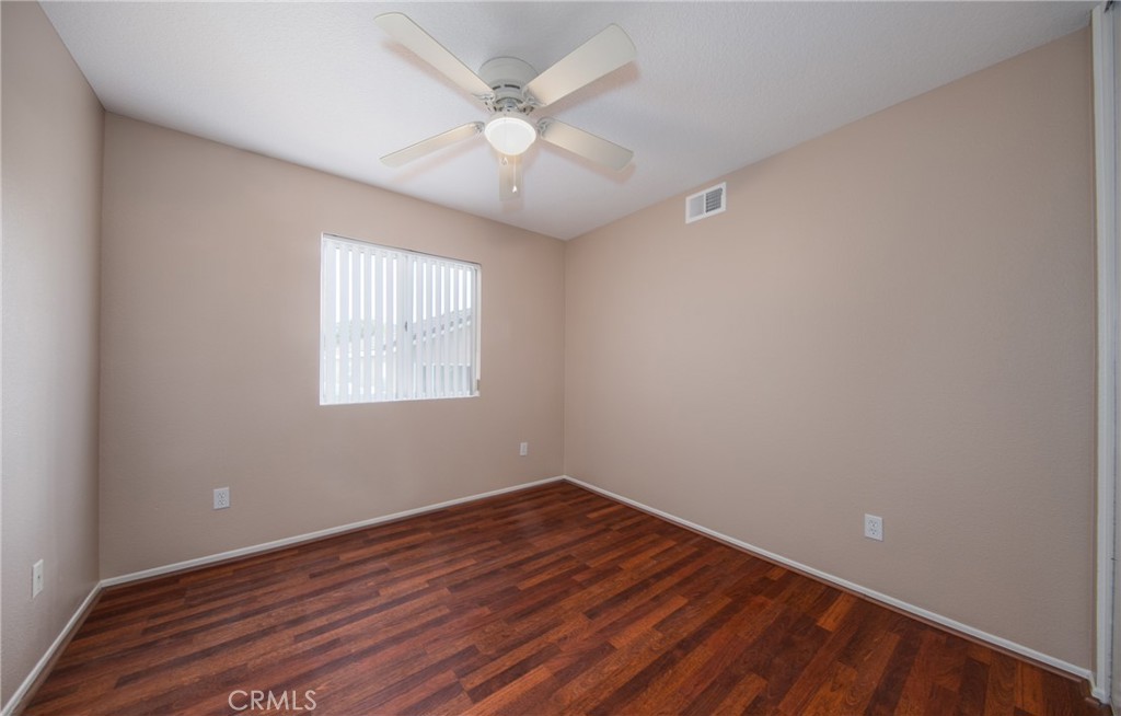 31255 Slate Street Mentone, CA 92359 - Photo 21 of 28 wooden floor in an empty room with a window