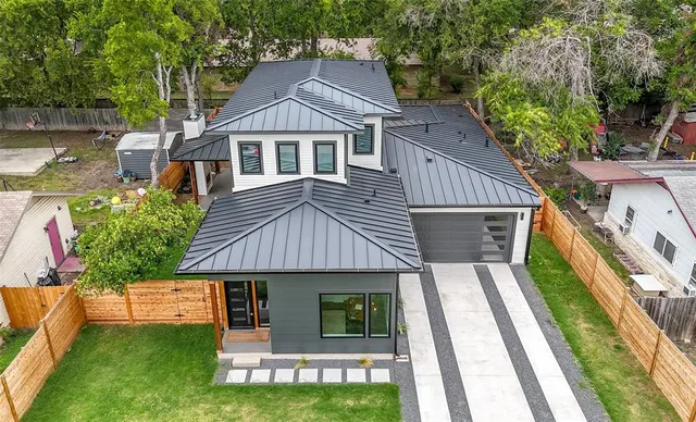 a aerial view of a house with a yard