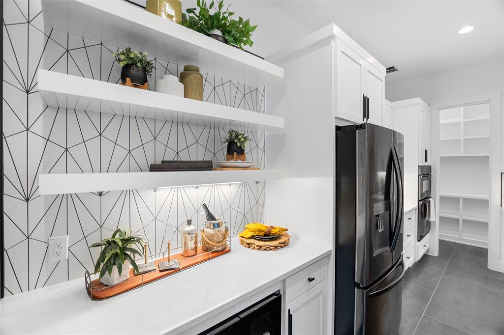 6304 Middleham Place Austin, TX 78745 - Photo 15 of 28 a kitchen with stainless steel appliances a refrigerator and a stove