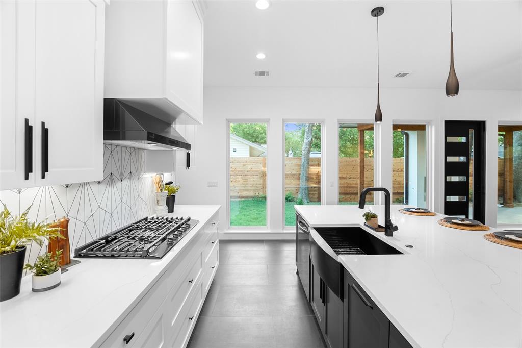 6304 Middleham Place Austin, TX 78745 - Photo 16 of 28 a kitchen with a stove and a view of living room