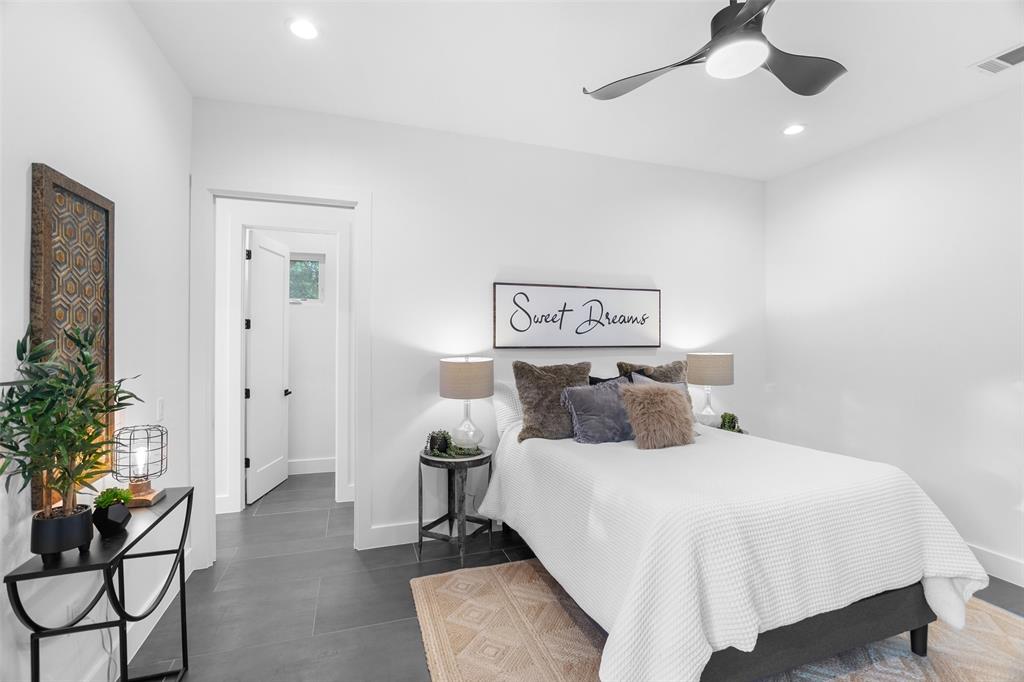 6304 Middleham Place Austin, TX 78745 - Photo 18 of 28 a bedroom with a bed and a potted plant