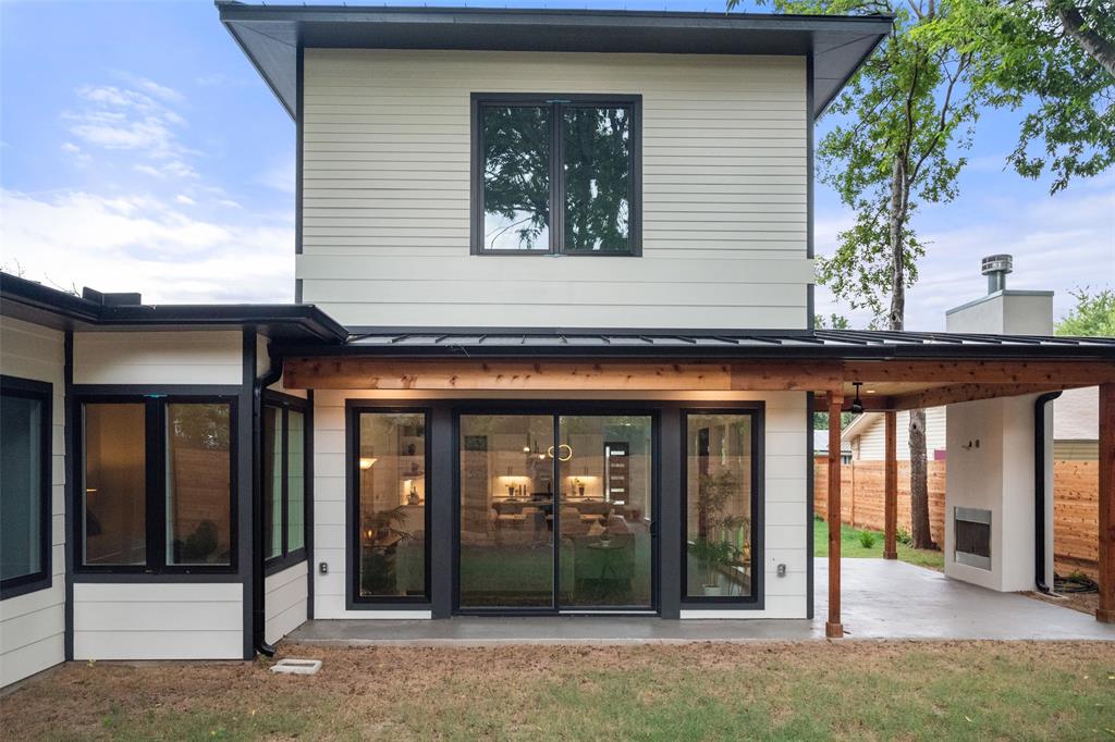 6304 Middleham Place Austin, TX 78745 - Photo 22 of 28 a view of a brick house with large windows