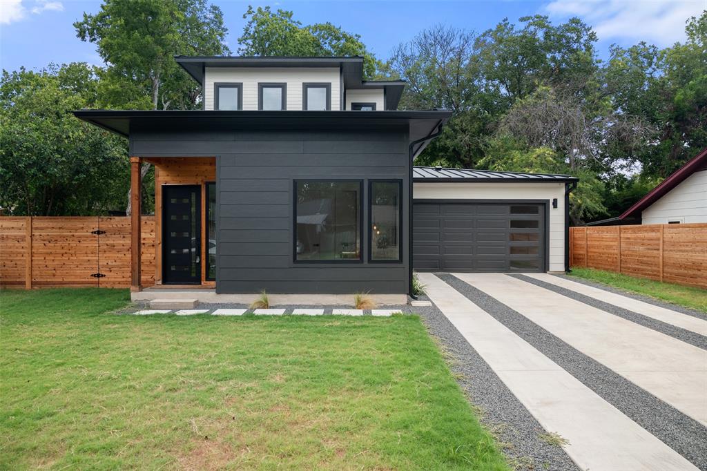 6304 Middleham Place Austin, TX 78745 - Photo 25 of 28 a front view of a house with a yard and garage