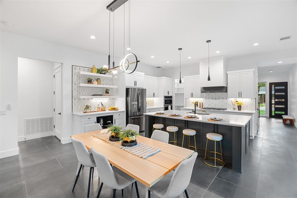 6304 Middleham Place Austin, TX 78745 - Photo 7 of 28 a large kitchen with a table and chairs