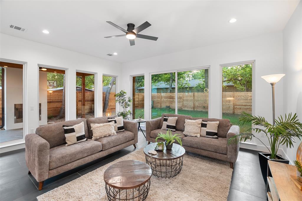 6304 Middleham Place Austin, TX 78745 - Photo 9 of 28 a living room with furniture and a large window