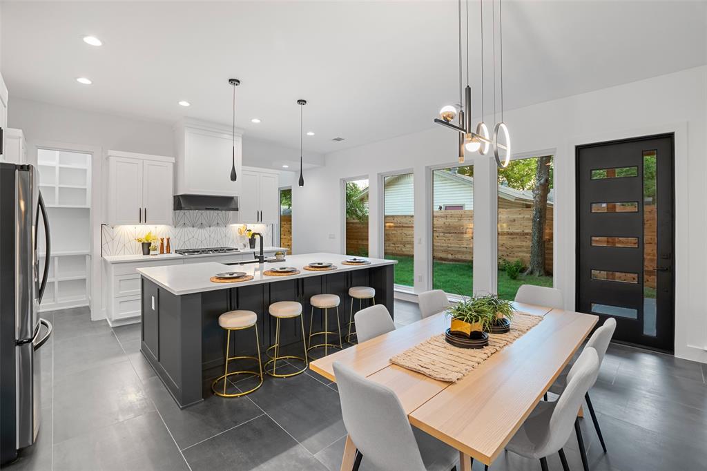 6304 Middleham Place Austin, TX 78745 - Photo 10 of 28 a kitchen with a table chairs and refrigerator