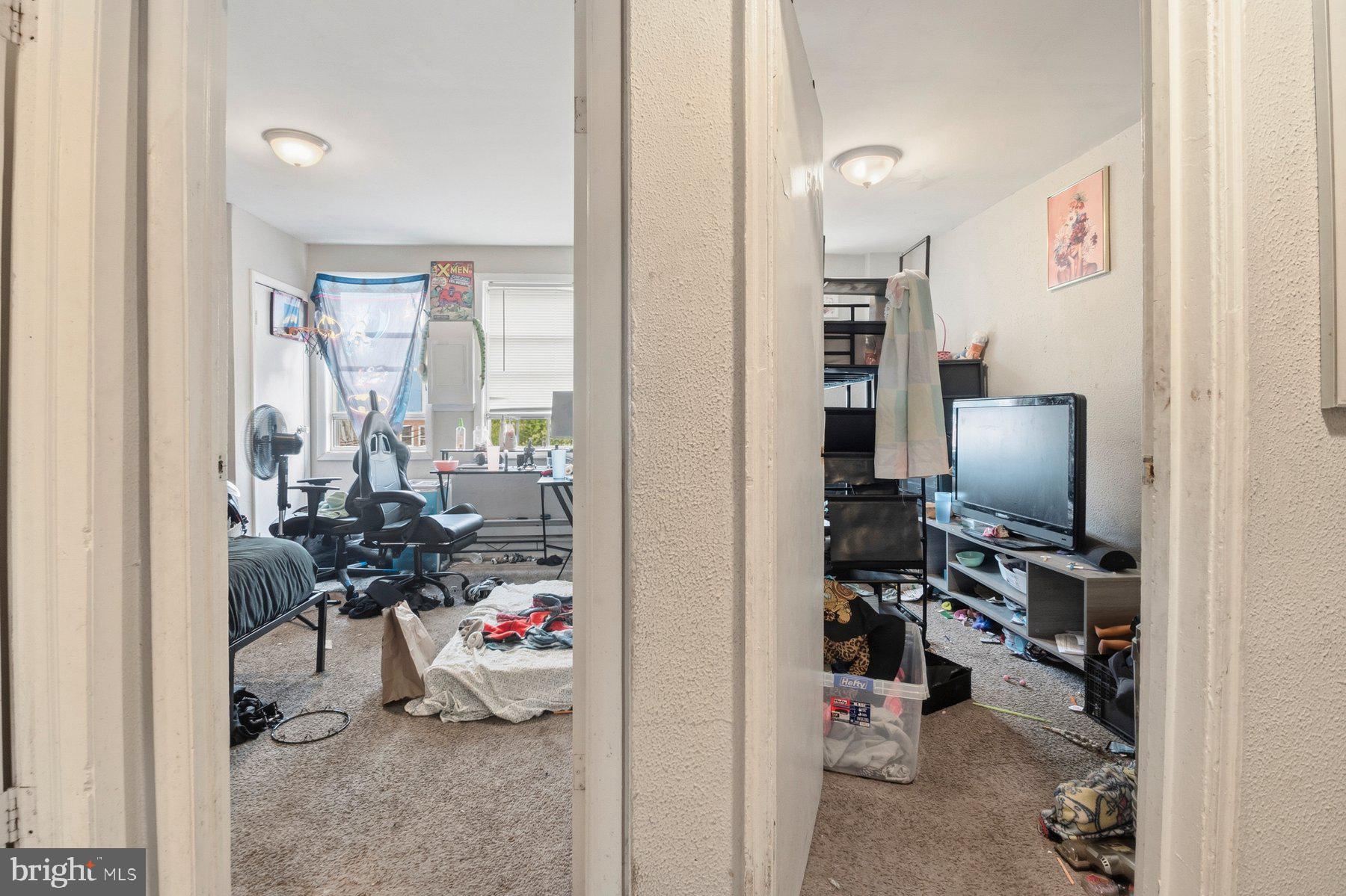 4931 Brookwood Road Baltimore, MD 21225 - Photo 22 of 25 a view of a livingroom with workspace and a window