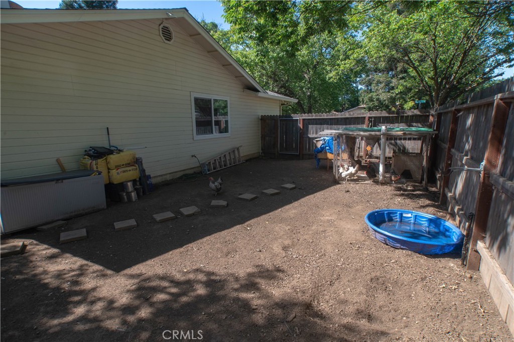1 San Ramon Drive Chico, CA 95973 - Photo 36 of 42 a backyard of a house with table and chairs