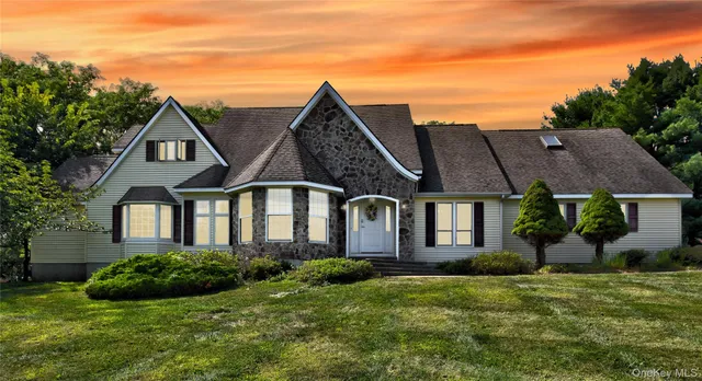 front view of a house with a yard