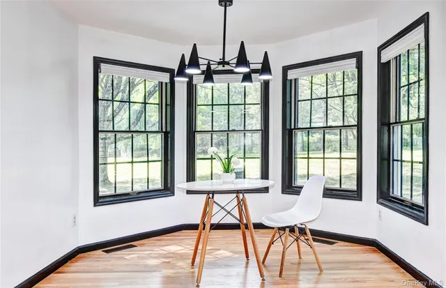 a kitchen with stainless steel appliances granite countertop a sink and a refrigerator