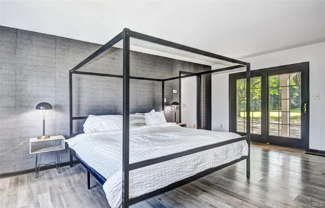 a bathroom with a granite countertop sink a mirror and a window