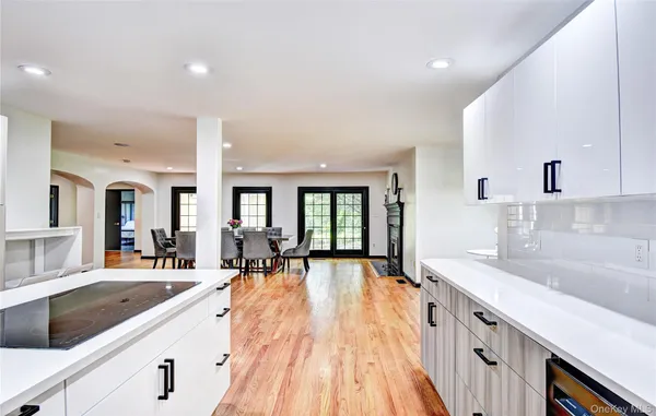 a dining room with furniture and wooden floor