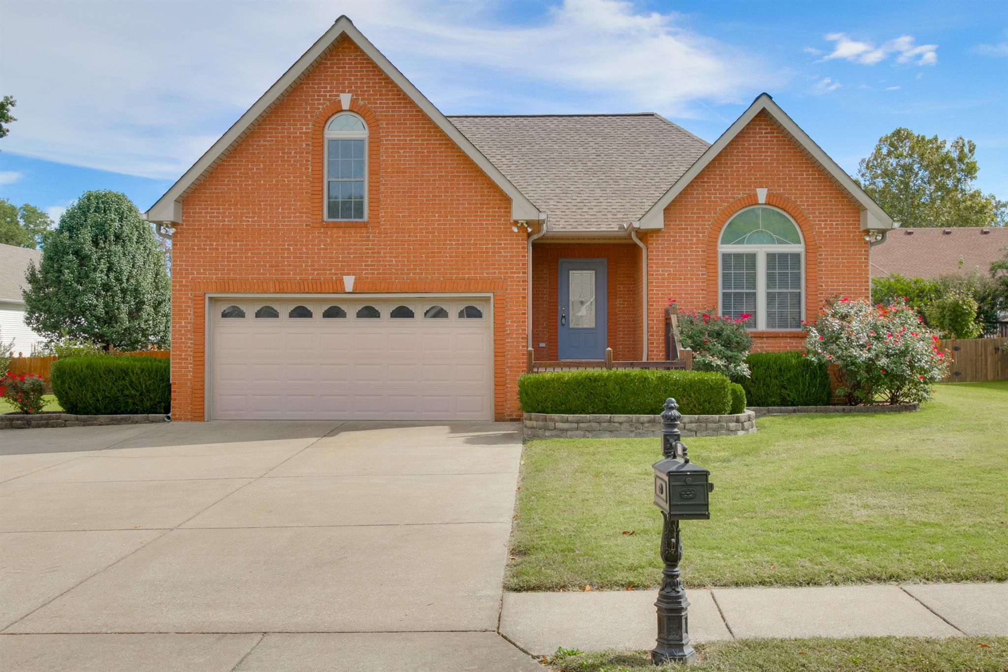 112 Fieldstone Lane Springfield, TN 37172 - Photo 1 of 24 a front view of a house with a yard and garage