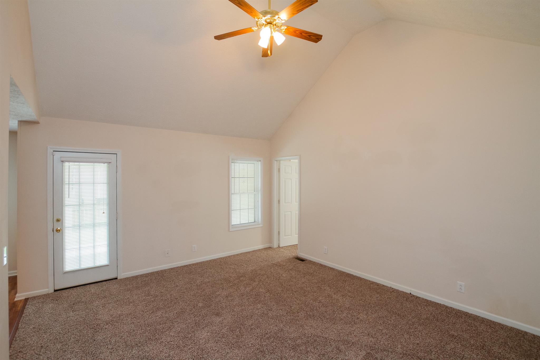 112 Fieldstone Lane Springfield, TN 37172 - Photo 9 of 24 an empty room with windows and fan