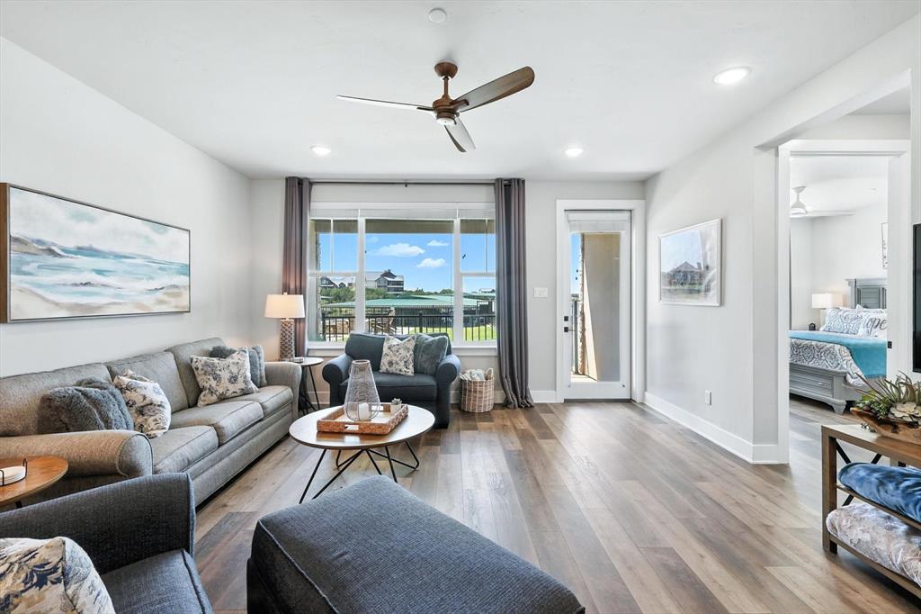 3412 Scenic Point Road, Unit 104 Graford, TX 76449 - Photo 11 of 35 a living room with furniture and a view of kitchen