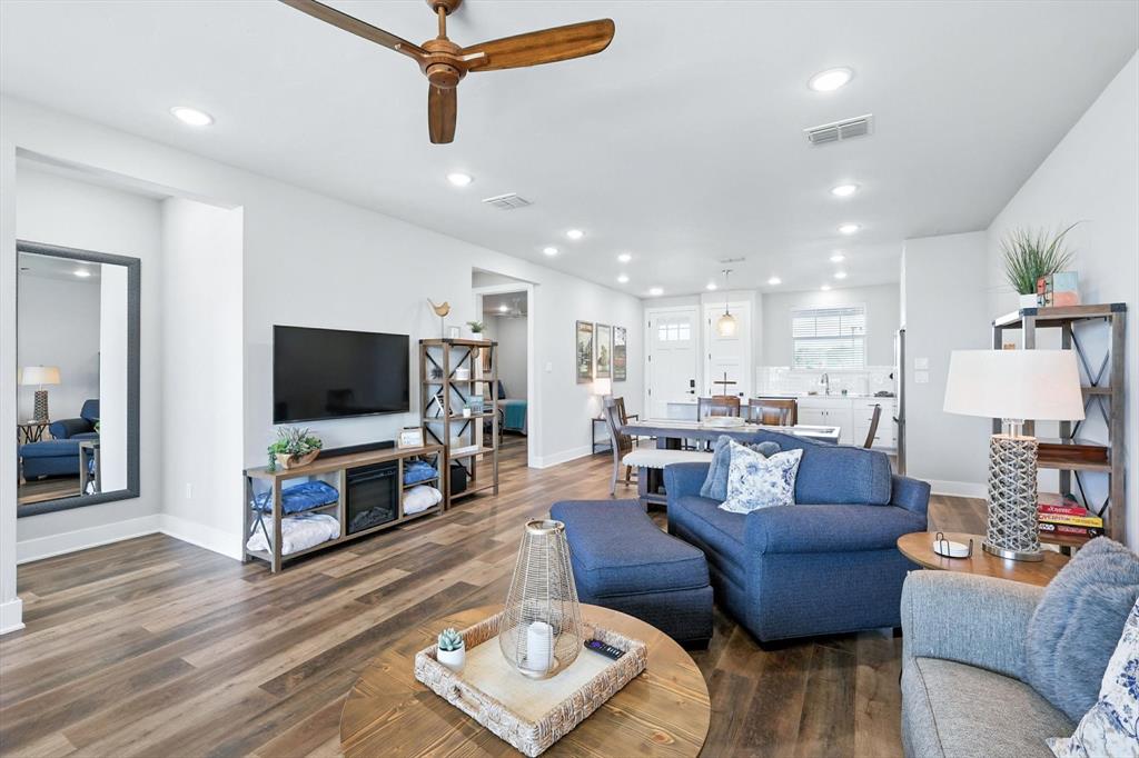 3412 Scenic Point Road, Unit 104 Graford, TX 76449 - Photo 13 of 35 a living room with furniture and a flat screen tv