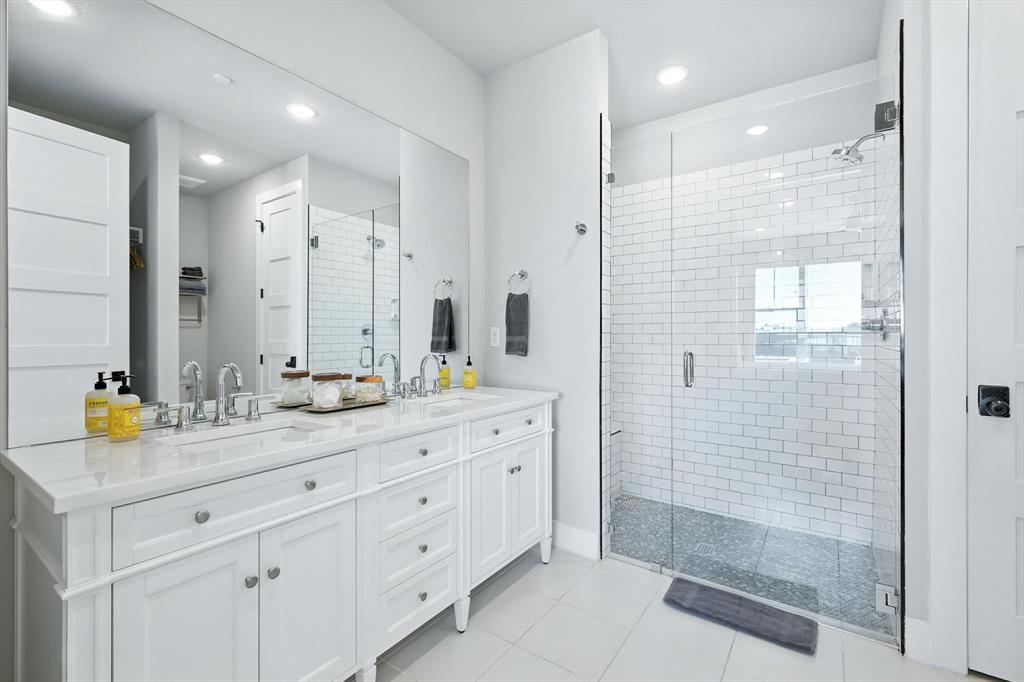 3412 Scenic Point Road, Unit 104 Graford, TX 76449 - Photo 15 of 35 a bathroom with a shower sink and mirror