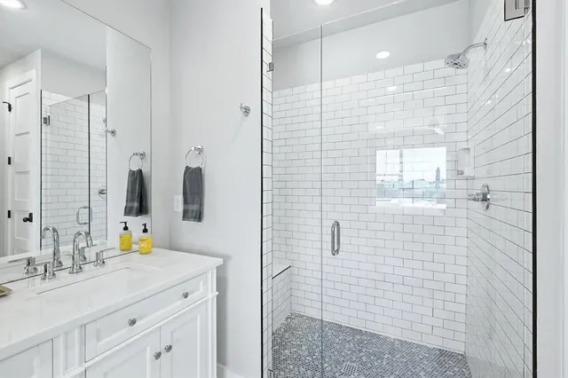 a bathroom with a sink double vanity and a mirror