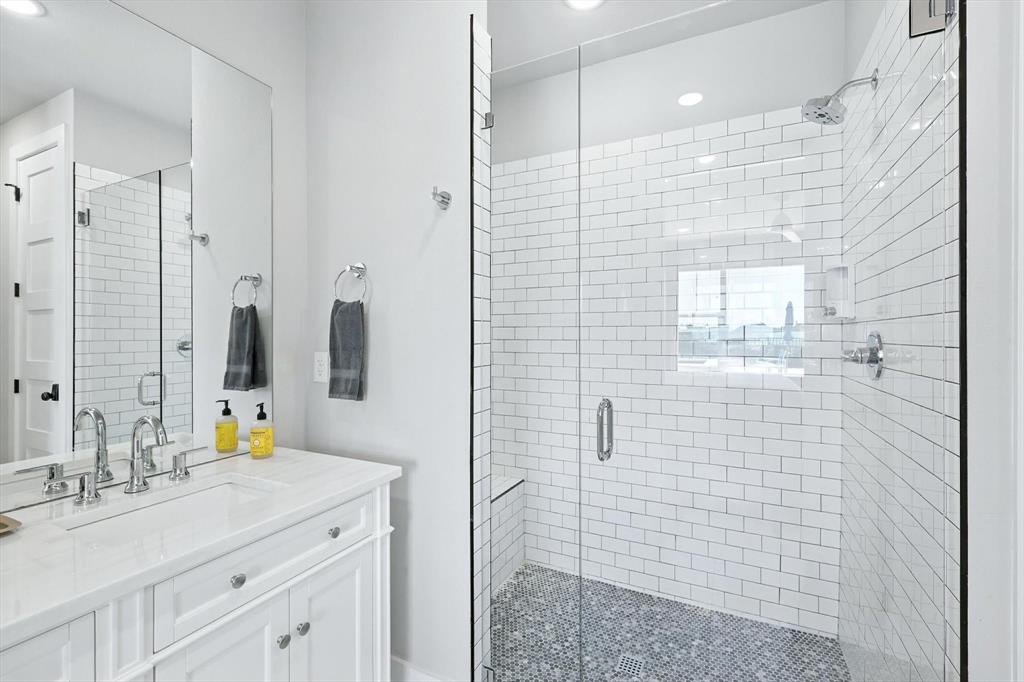 3412 Scenic Point Road, Unit 104 Graford, TX 76449 - Photo 17 of 35 a bathroom with a sink shower and a mirror