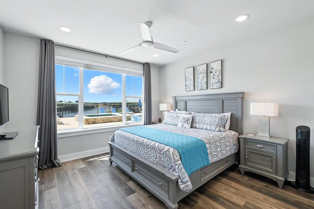 3412 Scenic Point Road, Unit 104 Graford, TX 76449 - Photo 18 of 38 King bed with ensuite bathroom