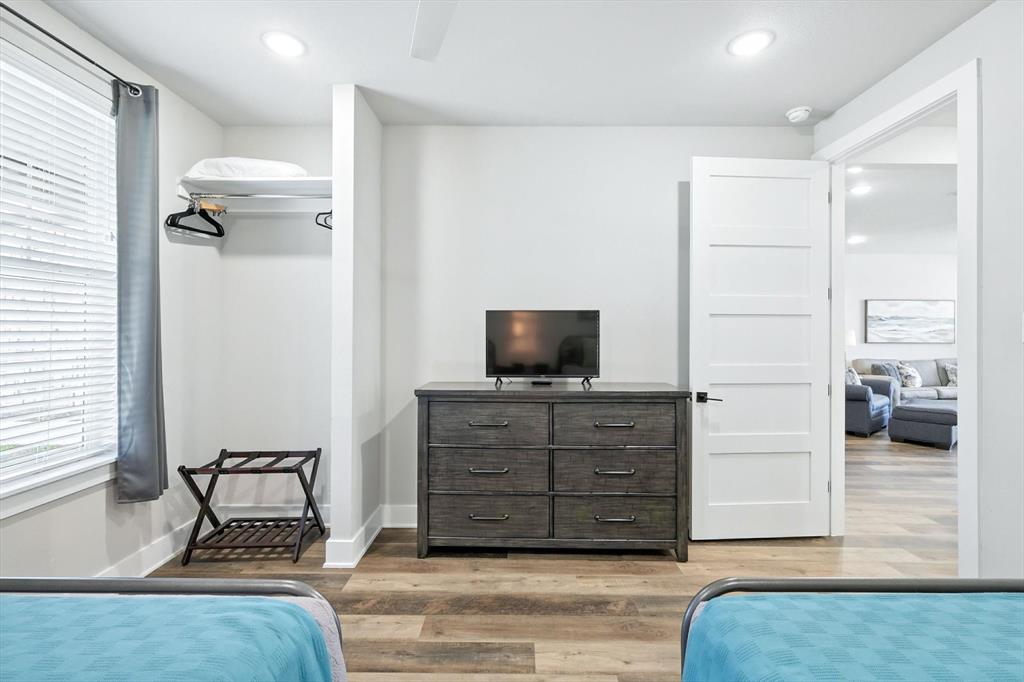 3412 Scenic Point Road, Unit 104 Graford, TX 76449 - Photo 20 of 35 a living room with furniture and flat screen tv