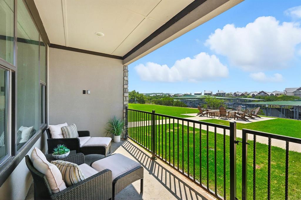 3412 Scenic Point Road, Unit 104 Graford, TX 76449 - Photo 22 of 35 a view of a balcony with furniture