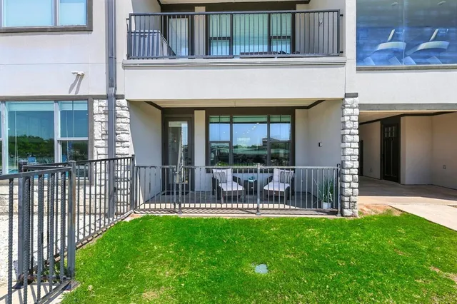a view of a big yard with table and chairs and a yard