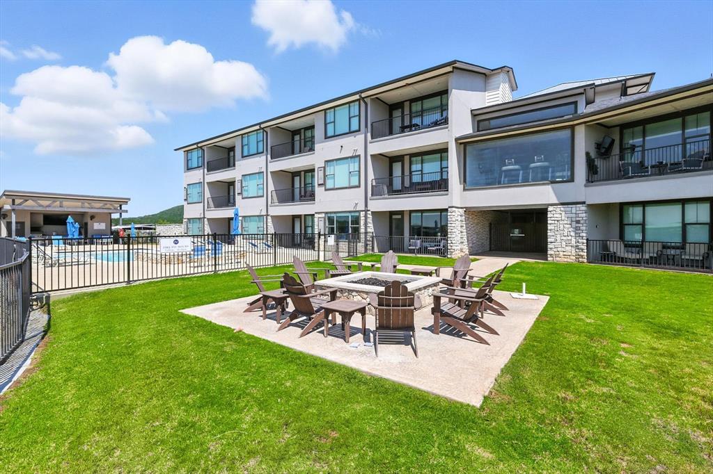 3412 Scenic Point Road, Unit 104 Graford, TX 76449 - Photo 28 of 35 a view of a building with a yard