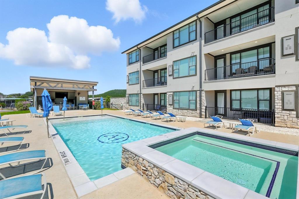 3412 Scenic Point Road, Unit 104 Graford, TX 76449 - Photo 32 of 35 a view of a house with swimming pool and sitting area