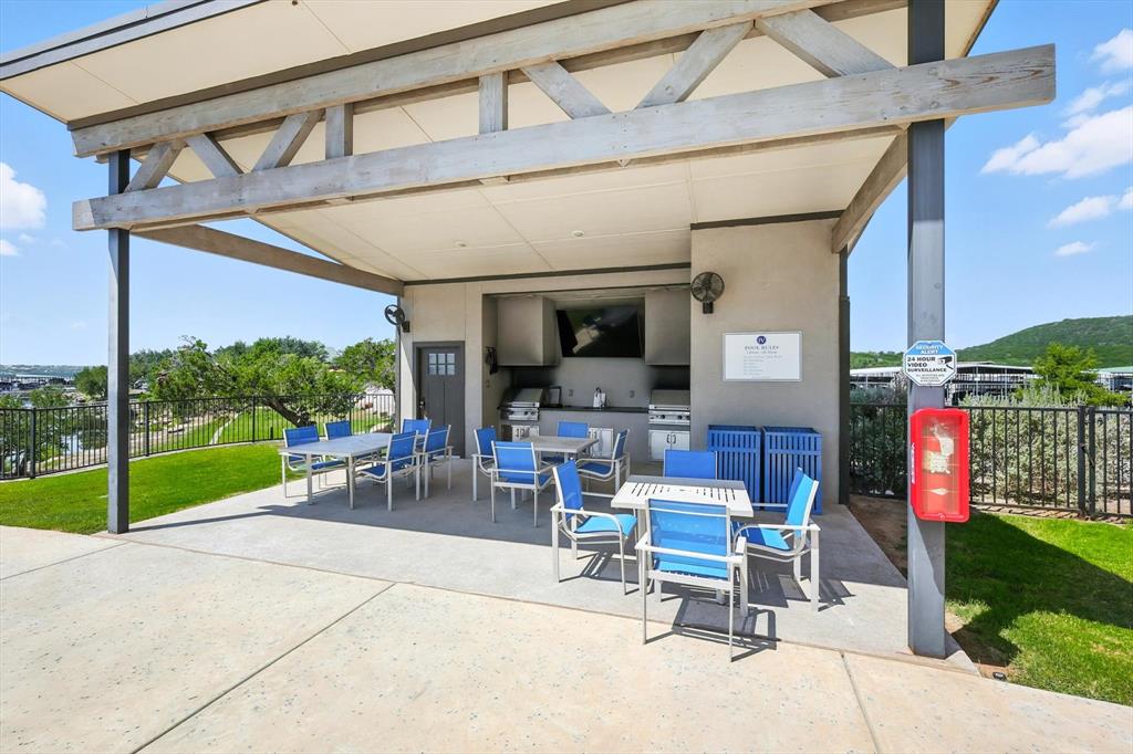 3412 Scenic Point Road, Unit 104 Graford, TX 76449 - Photo 33 of 35 a building outdoor space with patio furniture and garden