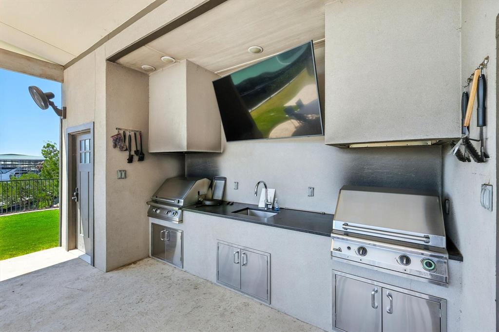 3412 Scenic Point Road, Unit 104 Graford, TX 76449 - Photo 34 of 35 a kitchen with a stove microwave and sink