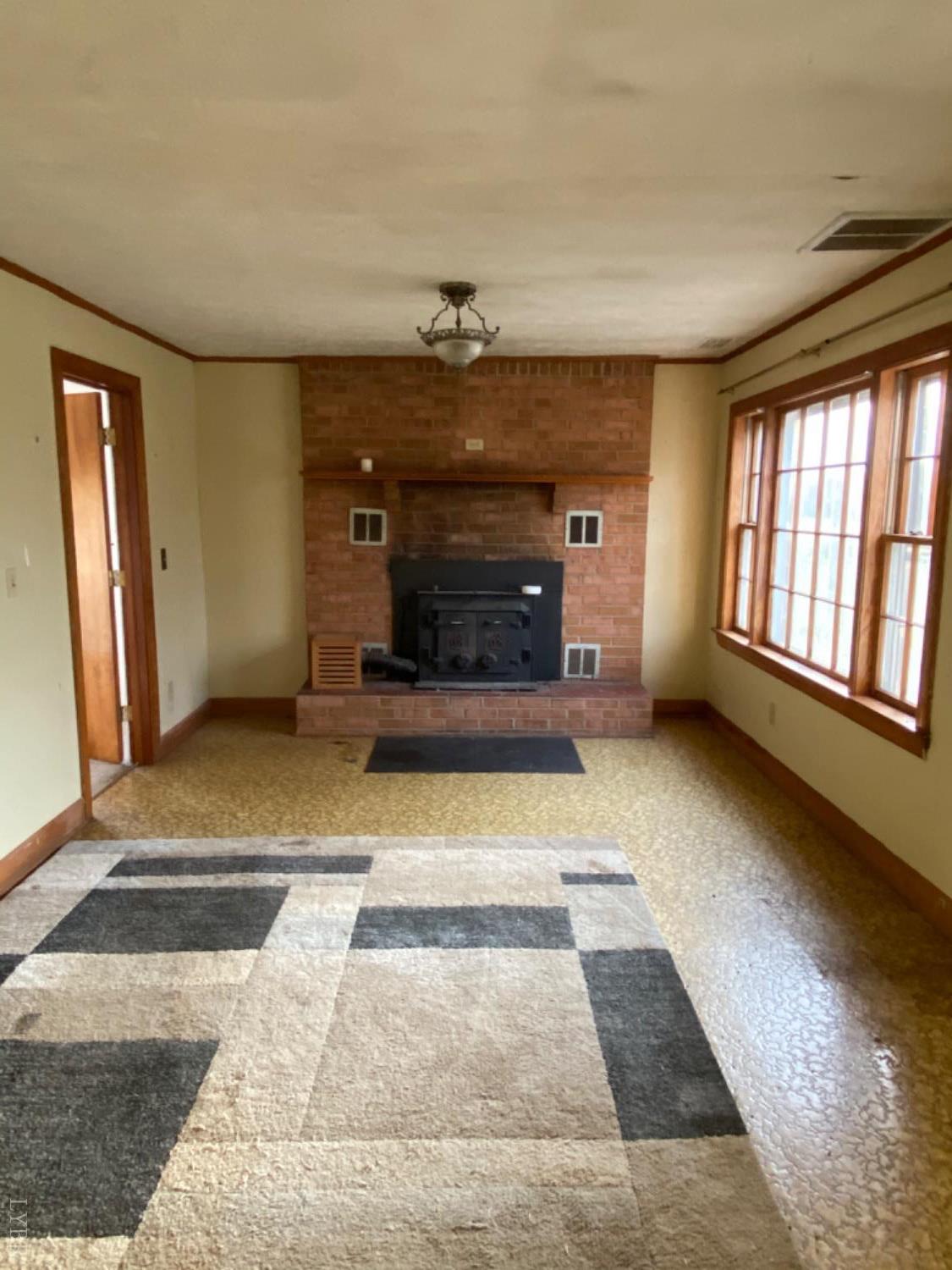 3211 Leesville Road Lynch Station, VA 24571 - Photo 21 of 22 a view of livingroom with a fireplace and window