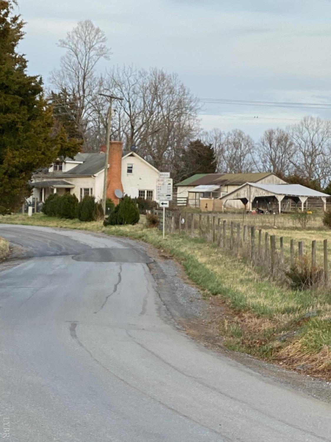 3211 Leesville Road Lynch Station, VA 24571 - Photo 22 of 22 a view of a street with a building and trees in the background