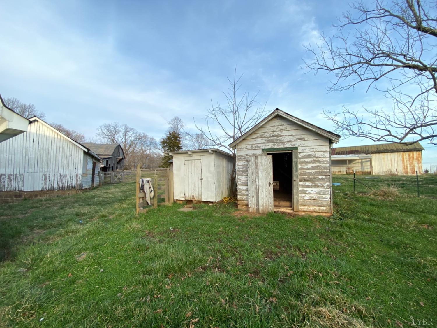 3211 Leesville Road Lynch Station, VA 24571 - Photo 8 of 22 a front view of a house with a yard and garage