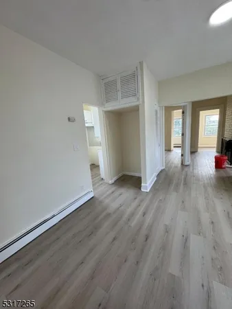 a view of a livingroom with wooden floor