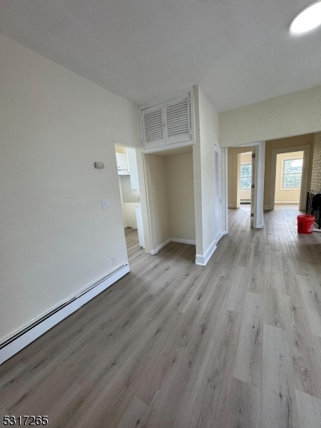 10 Riverside Place Garfield, NJ 07026 - Photo 4 of 26 a view of a livingroom with wooden floor