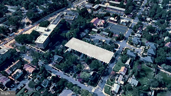 an aerial view of multiple houses with yard