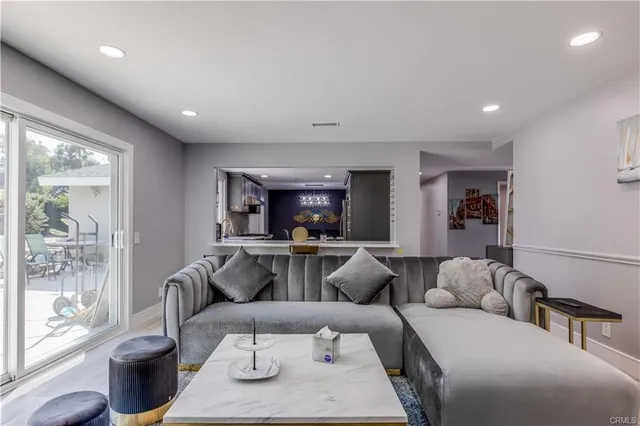 a living room with furniture and a large window