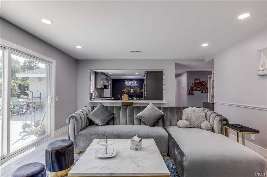 10664 Morning Glory Avenue Fountain Valley, CA 92708 - Photo 1 of 31 a living room with furniture and a large window