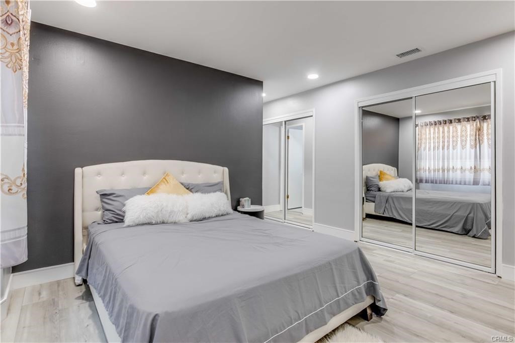 10664 Morning Glory Avenue Fountain Valley, CA 92708 - Photo 17 of 31 a bedroom with a bed and window